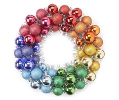 an assortment of christmas ornaments arranged in a rainbow circle on a white background with space for text