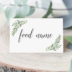 a place card with the word food name written in cursive writing on it