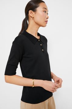 You'll wear this Black Milo Sweater Polo for seasons to come. Crafted from a buttery soft fabric, this classic style staple features fitted sleeves that can be slightly pulled up for a little puffed look. The straight shape and ribbed hem makes it perfect for layering, tucking in, and cosying up in. We are wearing it with denim, trousers, mini skirts (must we go on?) from work to play with ease and style. Spread collar Fitted sleeves Front three button placket Ribbed collar, cuff and hem Straigh Classic Formal Tops With Ribbed Cuffs, Formal Black Top With Ribbed Collar, Fitted Tops With Button Cuffs For Everyday, Fitted Top With Button Cuffs For Everyday, Sleek Tops With Button Cuffs For Fall, Elegant Top With Ribbed Cuffs And Relaxed Fit, Elegant Relaxed Fit Top With Ribbed Cuffs, Summer Style Guide, Sweater Polo