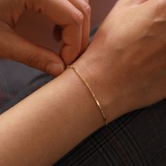 "Singapore Chain with Bar Detail, Gold Chain Bracelet, 14K Solid Gold Bracelet, Simple Chain Bracelet, Layering Jewelry ≫ Product Details ◈ Handmade / Handcrafted Fine Jewelry ◈ Thickness: 1.00mm ◈ Metal: Solid 14K Gold ◈ Gold Color: White gold, Yellow gold ◈ Chain Length: 6\" ~ 7.5\" ≫ Please read our FAQ below for more detail." Dainty 14k Gold Jubilee Chain Bracelet, Dainty Sterling Silver Jubilee Bracelet In Yellow Gold, Minimalist 14k Gold Curb Chain Bracelet, Formal Gold Diamond Bracelet With Delicate Chain, Dainty Curb Chain Bracelet For Formal Occasions, Dainty Curb Chain Bracelet For Formal Events, Dainty Curb Chain Bracelets For Formal Occasions, Classic Formal Bracelet With Delicate Chain, Dainty Box Chain Bracelet For Formal Occasions