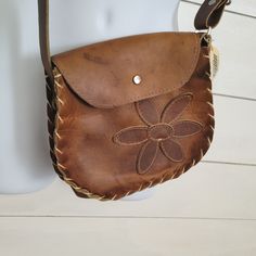 Vintage Authentic Mexican Brown Leather Hand Bag. Adjustable Strap For Cross Body Or Shoulder Strap. No Holes Or Tears In Leather. Marks Amd Scratches Are Ingrained In The Leather, Giving This Bag Character. The Crafted Flower Design Sewn Into Front Is Dainty And Beautiful. Brown Hand-stitched Crossbody Bag, Handmade Leather Casual Bag, Leather Hand-stitched Shoulder Bag, Casual Handmade Leather Bag, Handmade Leather Casual Shoulder Bag, Leather Bags Handmade Women, Tory Burch Camera Bag, Leather Purse Pattern, Thrift List