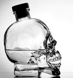 a glass bottle with a skull on it