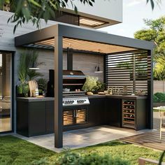 a modern outdoor kitchen with an oven, sink and table in the middle of it