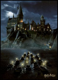 the hogwarts castle is lit up at night with boats floating on the water