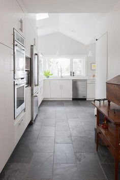 the kitchen is clean and ready to be used as a dining room or family room