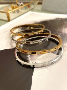 These chic bangles are crafted with fine details, featuring sparkling zircon and luxurious gold plating. Add a touch of elegance to any outfit and stand out from the crowd. Upgrade your style with Emma Bracelets today! Carrie Necklace, Heart Hoop Earrings, Clover Necklace, Black Necklace, Letter Necklace, Heart Bracelet, Tennis Bracelet, Gold Plating, Necklaces Bracelets