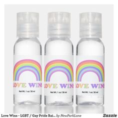 three water bottles with the words love, love, and win written on each bottle