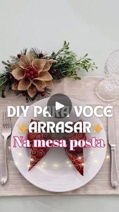 a place setting with silverware, napkins and christmas decorations on the table top