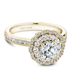 a yellow gold engagement ring with round diamonds on the band and an oval halo setting