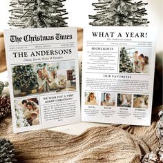 two christmas times brochures sitting on top of a table next to pine cones