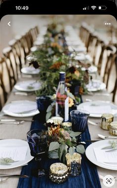 a long table with plates and place settings