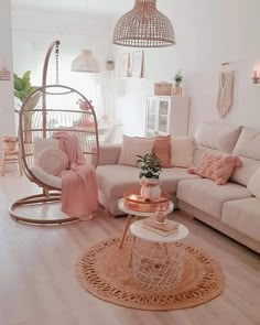 a living room filled with lots of furniture and decor on top of a hard wood floor