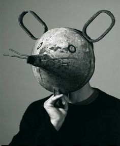 a person with a mouse mask on their head