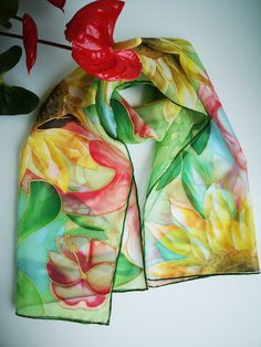 Appealing Hand painted silk scarf 'Arden Summer'. Yellow Sunflowers , Green Monstera Leaves, Pink /red Hibiscus and Flamingo birds forward to Fancy Holidays, tropical places, serenity and a contented life (Flamingos right represent this) --------------------------------------------------------------------------------------------------------------------- This scarf is MADE TO ORDER and available even in 6 OBLONG sizes and 3 SQUARES: 21*x21 inches (55x55cm)- Very small square- Kerchief; wrist, hea Summer Floral Print Silk Scarf As Gift, Green Bohemian Silk Scarf With Floral Print, Green Silk Scarves For Summer, Artistic Green Silk Scarf With Floral Print, Artistic Floral Print Summer Scarves, Artistic Floral Print Scarves For Summer, Multicolor Summer Shawl As Gift, Green Floral Print Scarves As Gift, Summer Multicolor Shawl As Gift