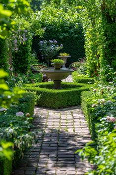 a garden with a fountain surrounded by greenery