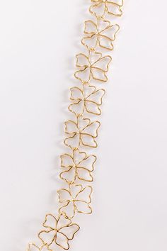 - Let your inner glam girl shine with this adorable necklace! - Gold colored metal material - An interconnected flower design - An adjustable length chain and clasp closure - Size: 13-16 inches Gold Plated Flower Shaped Jewelry For Parties, Gold Necklace 16 Inch For Party, Elegant Metal Necklaces With Flower Shape, Dainty Gold Jewelry For Party, Gold Alloy Choker For Parties, Metal Flower Clavicle Chain Necklace, Flower Shaped Metal Clavicle Chain Necklace, Metal Flower Clavicle Necklace, Gold Alloy Party Choker