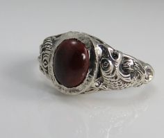 Estate sterling silver mans garnet ring size 9. great pre-owned condition. 5 grams. 12.36mm wide in front. Garnet Ring Men, Mens Garnet Ring, 1920s Ring, Victorian Rings, Ring Men, Red Band, Garnet Ring, Antique Engagement, Big Party