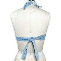 Denim Halter Upside-Down Pocket Mini Top Made from 100% recycled jeans Size 6 / Small Color: Denim Blue Ties in back and around neckline Features raw edges & intentionally exposed stitching DUE TO THE HANDMADE NATURE OF THIS GARMENT: SIZE / COLOR / DISTRESSING / OTHER IMPERFECTIONS MAY VARY ALL SALES FINAL Ripped Fitted Jeans In Recycled Denim, Fitted Ripped Jeans In Recycled Denim, Fitted Washed Blue Cutoff Jeans, Fitted Recycled Denim Cutoff Jeans, Fitted Cutoff Jeans In Recycled Denim, Fitted Cutoff Recycled Denim Jeans, Fitted Blue Denim Top From Recycled Material, Fitted Blue Recycled Denim Top, Fitted Recycled Denim Jeans For Summer