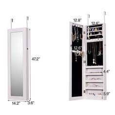 a white jewelry cabinet and mirror with measurements