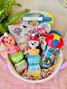 a basket filled with lots of toys on top of a table