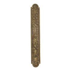 an antique brass door handle with leaves on it