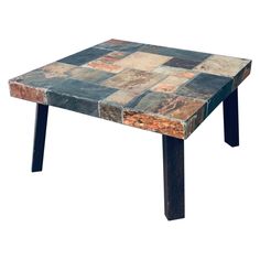 a table made out of different types of tiles on top of each other, with black legs