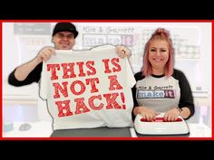 a man and woman holding up a t - shirt that says, this is not a hack