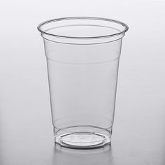 a clear plastic cup sitting on top of a table