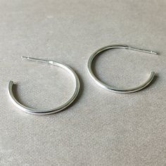 Simple and classic. Lightweight, dainty hoops to wear anywhere and everywhere. Everyday Silver Open Circle Hoop Earrings, Minimalist Tarnish-resistant Metal Hoop Earrings, Sleek Silver Sterling Hoop Earrings, Gold-toned Sterling Silver Hoop Earrings For Everyday Elegance, Sterling Silver Open Circle Hoop Earrings, Hoop Earrings Large, Open Hoop Earrings, Earring Cards, Mothers Necklace