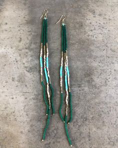 Green and Turquoise Hand Beaded Fringe Earrings. Some shell and brass beads. Made with Love. Lightweight Artisan Turquoise Beaded Earrings For Beach, Bohemian Turquoise Earrings With Gold Beads, Turquoise Beaded Heishi Beads Earrings, Turquoise Heishi Beads Beaded Earrings, Green And Turquoise, Beaded Fringe Earrings, Native Jewelry, Beaded Fringe, Shell Beads