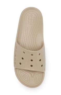 One of the best of Crocs basics gets an upgrade, with a refined upper for better fit and a more modern aesthetic. This Baya II Slide still features fully molded Croslite material, maximum lightweight cushioning, and signature ventilation. Cushioned insole Synthetic upper, lining and sole Imported Crocs Slides Outfit, Crocs Slides, Crocs Baya, Slides Outfit, Gender Inclusive, Girls Shoes Kids, Winter Sneakers, Winter Snow Boots, Unisex Shoes