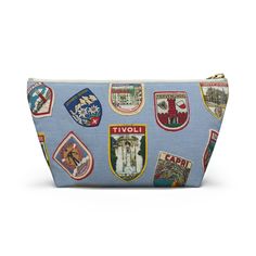 a blue zipper bag with patches on it