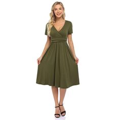 This dress features a V-neck design for a stylish and flattering look. Flattering V-neck Dress For Date Night, Flattering V-neck Wrap Dress For Summer, Chic V-neck Solid Color Midi Dress, Flattering V-neck Spring Dresses, Fitted V-neck Flattering Maxi Dress, Chic Midi-length V-neck Dress In Solid Color, Chic Solid Color Midi V-neck Dress, Green Surplice Neckline Midi Dress For Date Night, Green Midi Dress With Surplice Neckline For Date Night