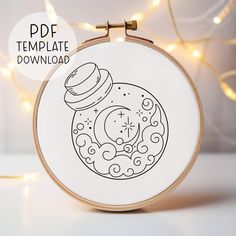 the embroidery pattern is being displayed in front of a white background with lights on it