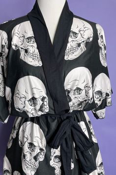 Our new Skull Study print robe is just the thing for Goth Ghoul summer! You can wear this as a dress or as a cover up by the pool. It's made from super soft peachskin jersey fabric. With a black belt to bring you in at the waist. Available in 2 sizes Small/Medium & Large/X-Large This is a made to order item which means it ships separately from the other items in my shop and takes up to 2 weeks to make and ship to you . No discounts can be used on made to order items. Black Summer Dress With All Over Print, Black Sleepwear For Vacation In Spring, Black Sleepwear For Spring Vacation, Black Wrap Kimono For Vacation, Black Beach Season Kimono For Vacation, One Size Black Kimono For Beach, Black Beachwear Kimono For Vacation, Black Dress With Kimono Sleeves For Festival, Black Open Front Vacation Dress