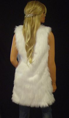 Classic and chic White Angora faux fur long vest with deep pockets on both sides and hidden hook and eye front closure. Extremely soft and luxurious high quality faux fur! Great fitting and easy to wear makes this the perfect way to add a little style to any dressy or casual attire. Fully lined with high quality satin. 100% high quality soft faux fur. Hand made in the USA. Sizes available in S, M, L, XL Hand wash cold, hang to dry. Most items from our shop ship within 1-2 business days. VIEW PIC Sleeveless Faux Fur Coat, Sleeveless Fur Coat With Faux Fur Trim, Sleeveless Faux Fur Coat With Fur Trim, Fur Leg Warmers, Faux Fur Shrug, Fur Shrug, Long Vest, Long Vests, Faux Fur Vest