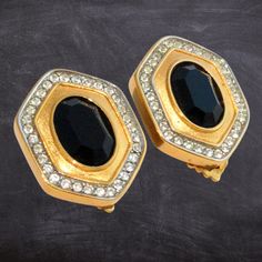 Elevate your style with these stunning Vintage LANVIN Earrings, signed Lanvin Germany and adorned with elegant black crystals surrounded by dazzling Swarovski diamante crystals. These geometric clip-on earrings feature a bold black glass domed hexagon design, crafted in Paris and made in Germany by the renowned couture design house of Jeanne Lanvin, founded in 1889. The gold-plated finish adds a luxurious touch to these statement pieces, making them the perfect accessory for lovers of retro fash Luxury Retro Clip-on Earrings, Elegant Jeweled Clip-on Earrings For Formal Events, Elegant Jeweled Clip-on Earrings For Formal Occasions, Glamorous Jeweled Clip-on Earrings For Formal Events, Elegant Black Metal Clip-on Earrings, Formal Black Jeweled Jewelry, Black Metal Clip-on Earrings For Evening, Evening Metal Clip-on Crystal Earrings, Elegant Evening Metal Crystal Clip-on Earrings