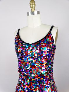 "This fun vintage party dress! It is fully embellished with rainbow paillette sequins and in excellent condition! Size SMALL Measurements: Bust - 32\" Waist - 26\" Hips - 36\" Length - 34\" Tag Size - 4 / Small (please refer to measurements) Size MEDIUM Measurements: Bust - 34\" Waist - 28\" Hips - 38\" Length - 33\" Tag Size - 6 /Medium (please refer to measurements) This dress comes from a pet-free and smoke-free home. If you would like more info or have any questions, please don't hesitate to Rainbow Glitter Dress, Sparkly Rainbow Dress, Multicolor Sequin Fabric For Summer Night Out, Multicolor Sequin Fabric For Summer Nights, Multicolor Contrast Sequin Party Dress, Multicolor Contrast Sequin Dress For Party, Summer Festive Sequin Dress, Embellished Multicolor Sequin Dress For Night Out, Multicolor Embellished Sequin Dress For Night Out