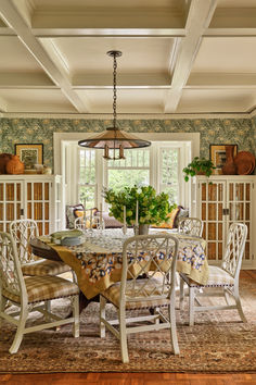 the dining room table is surrounded by chairs