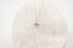 Tiny 14k solid gold oval evil eye pendant. The eye shaped pendant has a light white center and a light blue outer edge. The 14k solid gold chain is available in 3 different lengths, please make your choice from the drop down menu. Length: 8 mm / 1/3 inch . Perfect gift for Valentine or any other special occasion. Comes in a gift box. Also available as a tearshaped and round pendant: https://www.etsy.com/listing/720546855/tiny-evil-eye-necklace-solid-gold-white? https://www.etsy.com/listing/85170 14k Gold Silver Evil Eye Necklace, Silver Evil Eye Necklace In 14k Gold, Silver 14k Gold Evil Eye Necklace, Silver 14k Gold Necklace With Evil Eye, Minimalist Sterling Silver Evil Eye Jewelry, Sterling Silver Evil Eye Necklace For Everyday, Minimalist Eye-shaped Jewelry Gift, Round Evil Eye, Necklace Sale