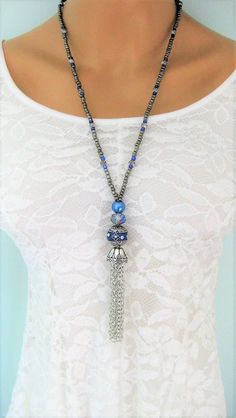 Bohemian Style Tassel Necklaces handmade by Ralston Originals. All the tassels are made with silver metal chains, and is covered in a beautiful antique silver metal bead cap. The first necklace (pictures 1-2) is made with a large beautiful sparkling blue bead with silver metal accents, and tiny rhinestones. The necklace has a large blue crystal bead, and a blue pearl bead. The remainder of the necklace has silver metal beads, and blue and dark silver seed beads. The second necklace (pictures 3-4 Beaded Tassel Necklace, Eyeglass Chain, Necklaces For Women, Estilo Boho, Style Boho, Black Crystals, Blue Beads, Blue Crystals, Metal Beads