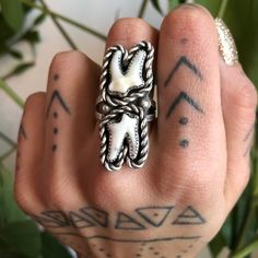 This ring is handmade from sterling silver. It features two real raccoon teeth. This is a unique one of a kind design. It is very durable and sturdy. Made to last. This is a made to order item. It will be finished and shipped within two weeks of the order date. Because this is made to order and made from real natural teeth, the tooth size may very slightly. They will however be very similar to the ring pictured. Choose your size! Questions or comments? Please feel free to contact me directly! Elk Teeth Ring, Bone Hand Rings, Goth Tooth Jewelry, Weird Rings Silver, Cat Teeth Jewelry, Buffalo Teeth Jewelry, Human Teeth Jewelry, Raccoon Teeth, Tooth Ring