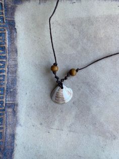 Handmade sea shell necklace crafted with brown hemp cord and brown wooden beads. Cheap Handmade Shell Necklaces, Sea Shell Necklace Men, Marine Crafts, Shell Necklace Diy, Homemade Beads, Homemade Necklaces, Sea Shell Necklace, Diy Collier, Long Branch