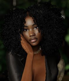 a woman with an afro is posing for the camera