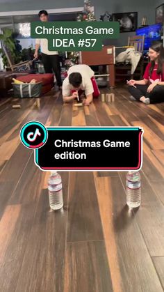 people are sitting on the floor in front of a sign that says christmas game edition