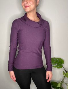 Handmade to order. Eco-Friendly dyed super Stretchy bamboo fleece blend made with Organic cotton. This top is amazingly soft and warm! Dress it up or keep it casual!  This material has a great stretch and feel and warmth. Additional colors and sizes available upon request. If you fall between sizes or your size is not listed please include that in the note at Check out. Feel free to email with any questions.  Measurements are encouraged to ensure proper sizing! Measurements can be included in purchase notes with order. Model pictured is 5'3, about 120lbs and wearing a size small. *Care Instructions:  For best and longest lasting quality, we recommend hand-washing with cold water and mild natural detergent. If using a machine washer, use cold water on delicate setting. We highly recommend h Comfortable Fitted Tops For Fall, Comfortable Fitted Long Sleeve Tops, Comfortable Winter Tops For Relaxation, Relaxed Fit Soft Knit Funnel Neck Top, Cozy Soft Knit Purple Top, Cotton Tops For Relaxation In Fall, Comfortable Tops For Relaxation In Fall, Cozy Stretch Top With Funnel Neck, Fall Cotton Tops For Relaxation