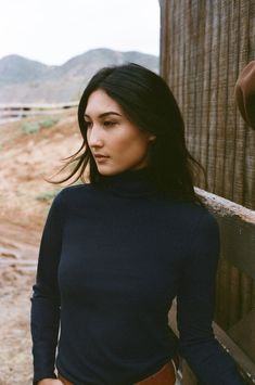 Model Tamzin Wears size XS (5’6” tall, 25” inch waist, 32b” chest, Hips - 36”) The Big Shot turtleneck is a slim fit top with button cuffs. This product is made with Merino Wool. The merino is all traceable, non mulesed and RWS certified. All of the polyester used in this yarn is recycled. A luxury wool with inherent performance enhancing qualities: Thermal-regulating, moisture wicking, antimicrobial, water repellant and soft yet durable. - 100% Merino Wool- Long sleeve with cuff - Turtleneck co Classic Fitted Funnel Neck Turtleneck, Classic Fitted Turtleneck With Funnel Neck, Classic Fitted Turtleneck For Work, Classic Fitted High Neck Top, Fitted Funnel Neck Top For Work, Slim Fit Top, Wool Turtleneck, Equestrian Outfits, Big Shot