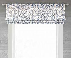 a window with a blue and white roman blind