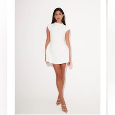 Like New Condition White Mini Dress With Structured Shoulders For Party, White Mini Dress With Structured Shoulders For Evening, White Short Sleeve Mini Dress For Formal Occasions, Chic Mini Dress With Structured Shoulders For Summer, White Fitted Mini Dress In Feminine Style, Chic Summer Mini Dress With Structured Shoulders, White Fitted Mini Dress With Structured Shoulders, White Mini Dress With Structured Shoulders For Spring, White Mini Dress For Work