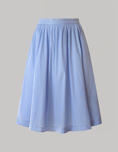 The Grace skirt is a chic and versatile wardrobe essential designed with radiant summer days in mind. Crafted from light and breathable organic cotton Vichy stretch fabric, this pale blue flowy skirt with a high waistline falls just below the knees, offering a timeless silhouette. Whether for casual or polished looks, experience comfort, and sophistication effortlessly with this stylish midi skirt. Summer Flared Maxi Skirt For Daywear, Summer Full Skirt For Daywear, Spring Daywear Maxi Skirt With Gathered Design, Voluminous Pleated Midi Skirt For Summer, Blue Gathered Maxi Skirt For Summer, Summer Daywear Maxi Skirt, Light Blue Flowy Cotton Skirt, Summer Long Pleated Skirt For Daywear, Blue Full Maxi Skirt For Summer